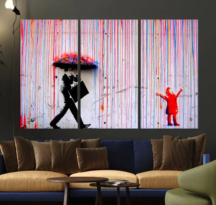 Introducing the Banksy Street Art Wall Art Canvas Print, a captivating piece featuring modern art of a man with an umbrella while a child reaches up through vibrant drips. Its premium canvas and gallery-quality finish make it an eye-catching addition to any space.