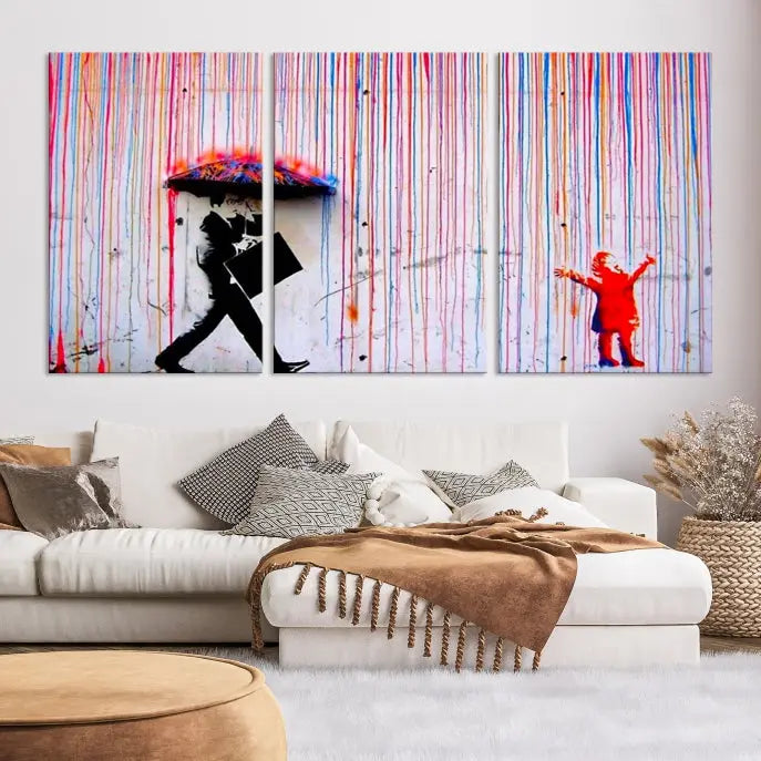 Introducing the Banksy Street Art Wall Art Canvas Print, a captivating piece featuring modern art of a man with an umbrella while a child reaches up through vibrant drips. Its premium canvas and gallery-quality finish make it an eye-catching addition to any space.