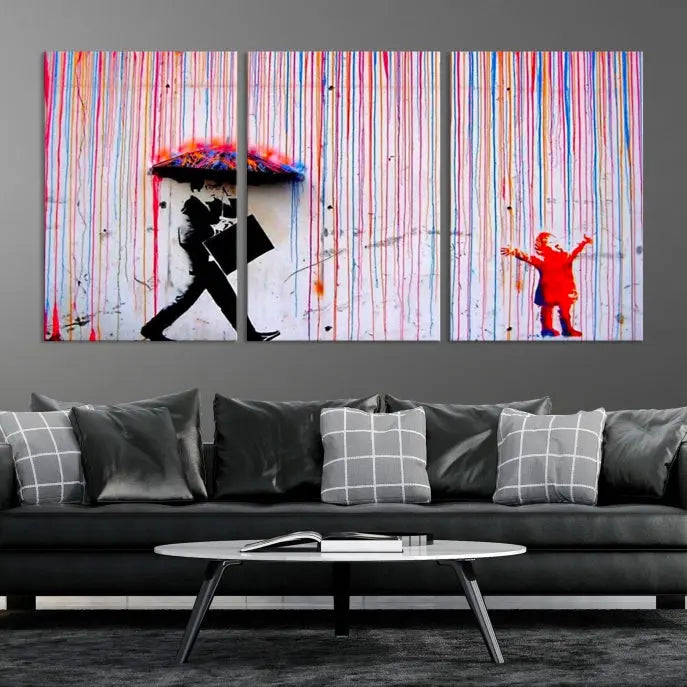 Introducing the Banksy Street Art Wall Art Canvas Print, a captivating piece featuring modern art of a man with an umbrella while a child reaches up through vibrant drips. Its premium canvas and gallery-quality finish make it an eye-catching addition to any space.