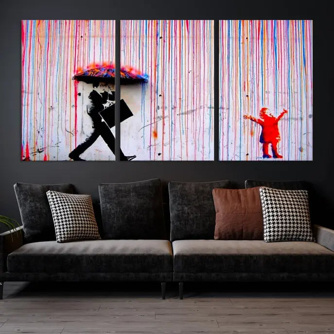 Introducing the Banksy Street Art Wall Art Canvas Print, a captivating piece featuring modern art of a man with an umbrella while a child reaches up through vibrant drips. Its premium canvas and gallery-quality finish make it an eye-catching addition to any space.