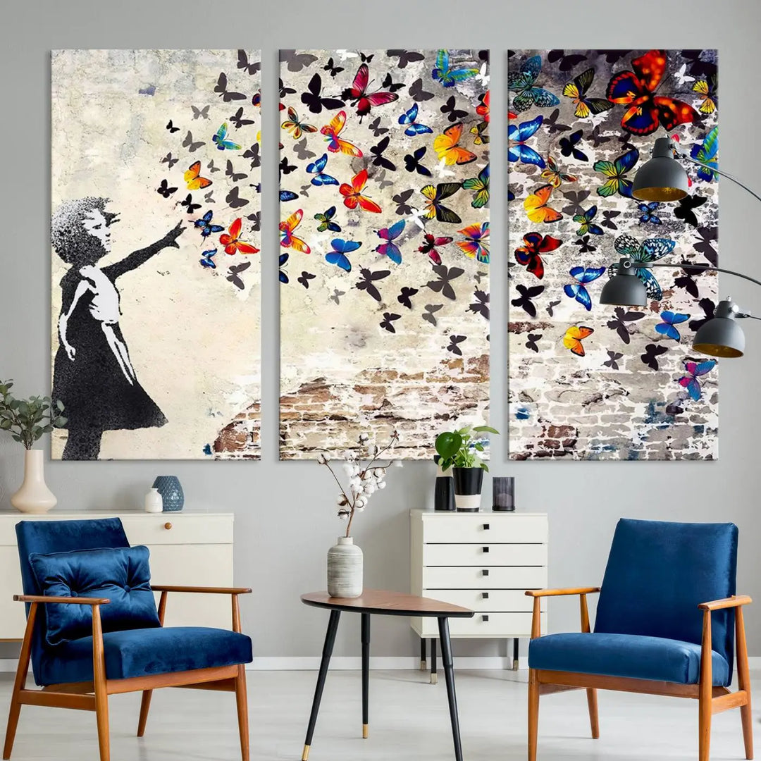 The Banksy Style Wall Art Print, featuring the Banksy Girl with Butterflies design, is a beautiful framed ready-to-hang triptych canvas that depicts a child releasing vibrant butterflies. It creates an enchanting tribute reminiscent of a Banksy scene.