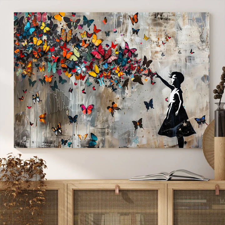 The Banksy Girl and Butterfly Explosion wall art canvas is a vibrant triptych that features textured depth, perfect for display.