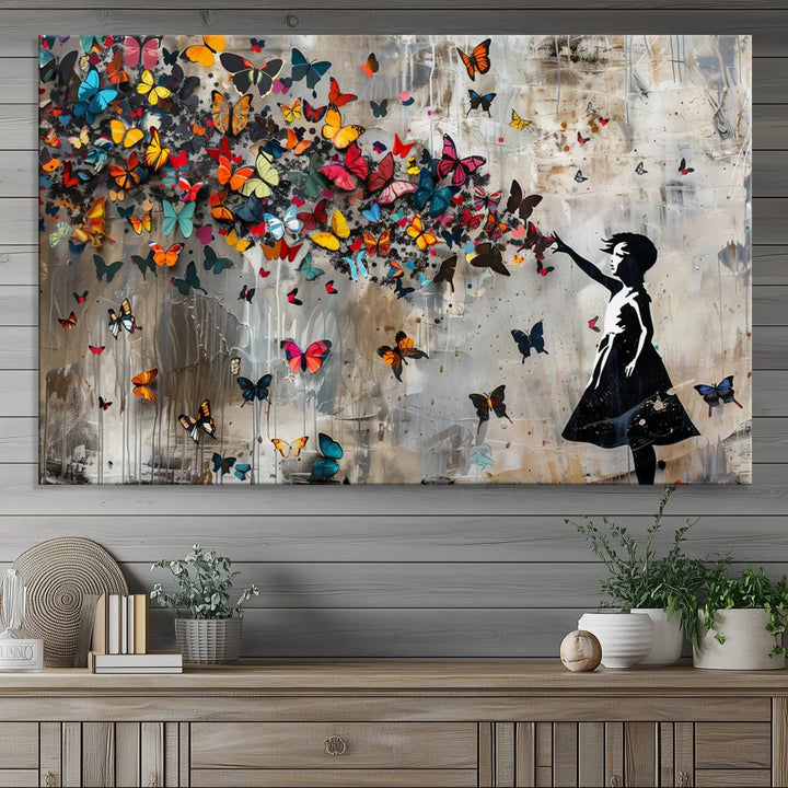 The Banksy Girl and Butterfly Explosion wall art canvas is a vibrant triptych that features textured depth, perfect for display.