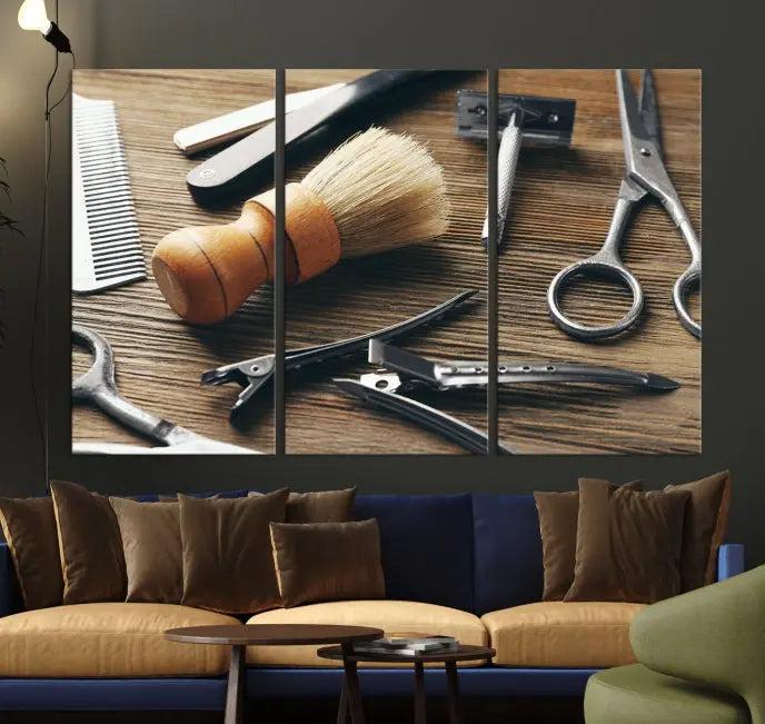 The Barber Tools Wall Art Canvas Print elegantly showcases the barbering profession with illustrations of tools like scissors, a brush, and a comb.