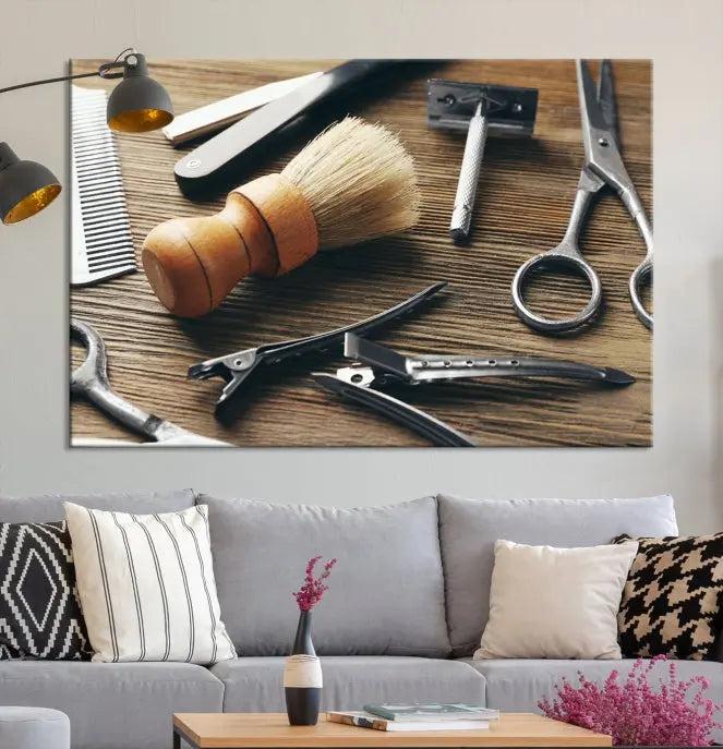 The Barber Tools Wall Art Canvas Print elegantly showcases the barbering profession with illustrations of tools like scissors, a brush, and a comb.