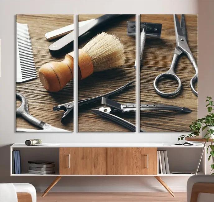 The Barber Tools Wall Art Canvas Print elegantly showcases the barbering profession with illustrations of tools like scissors, a brush, and a comb.