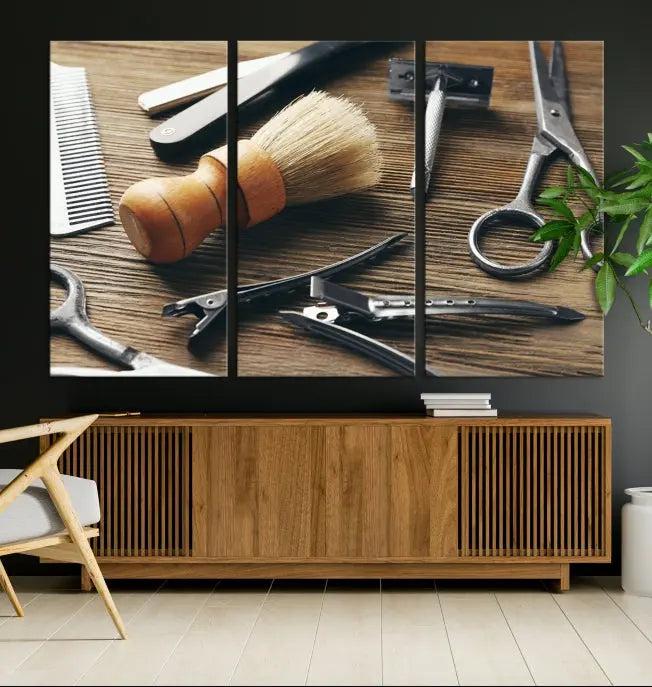 The Barber Tools Wall Art Canvas Print elegantly showcases the barbering profession with illustrations of tools like scissors, a brush, and a comb.