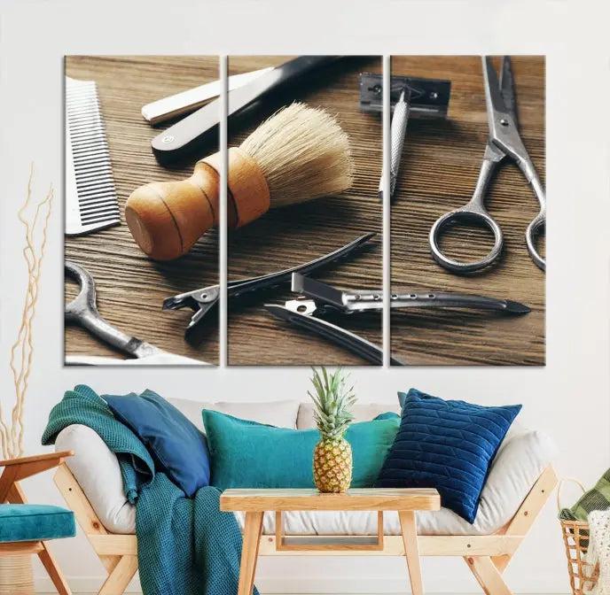 The Barber Tools Wall Art Canvas Print elegantly showcases the barbering profession with illustrations of tools like scissors, a brush, and a comb.