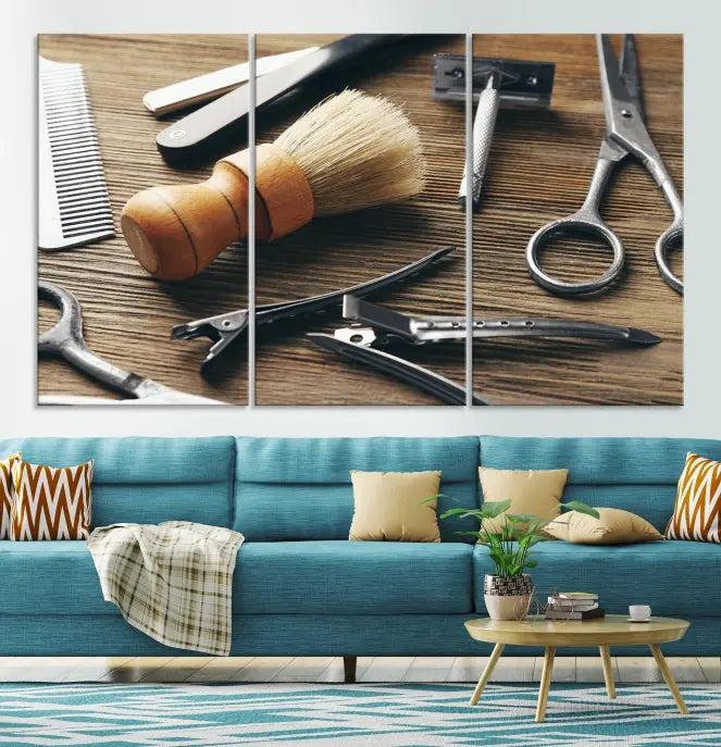 The Barber Tools Wall Art Canvas Print elegantly showcases the barbering profession with illustrations of tools like scissors, a brush, and a comb.