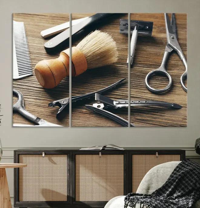 The Barber Tools Wall Art Canvas Print elegantly showcases the barbering profession with illustrations of tools like scissors, a brush, and a comb.