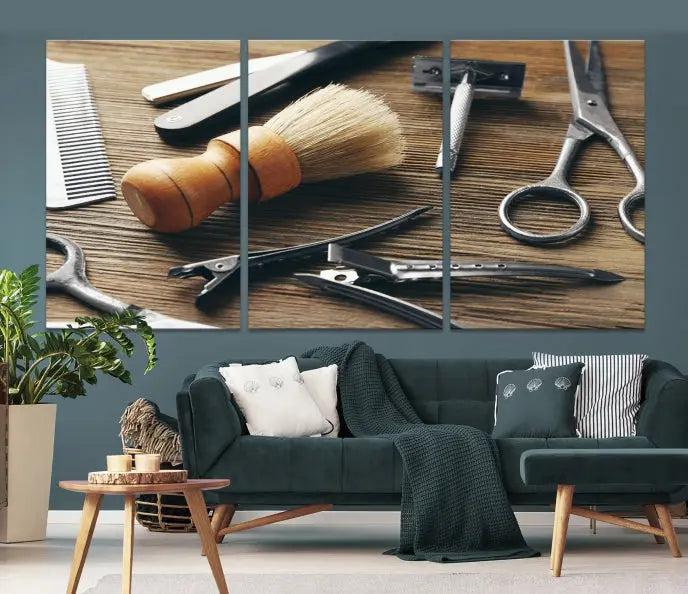 The Barber Tools Wall Art Canvas Print elegantly showcases the barbering profession with illustrations of tools like scissors, a brush, and a comb.