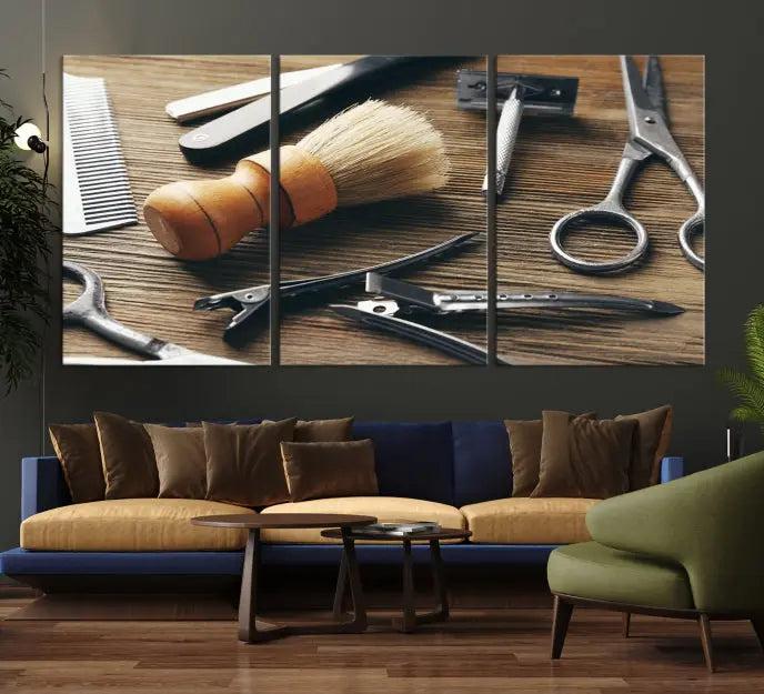 The Barber Tools Wall Art Canvas Print elegantly showcases the barbering profession with illustrations of tools like scissors, a brush, and a comb.