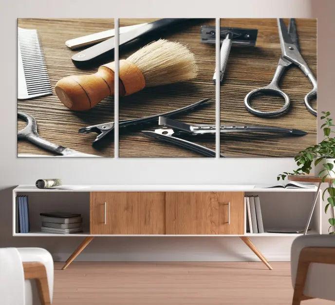 The Barber Tools Wall Art Canvas Print elegantly showcases the barbering profession with illustrations of tools like scissors, a brush, and a comb.