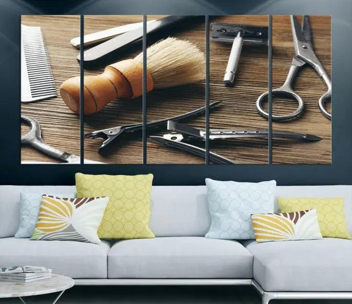 The Barber Tools Wall Art Canvas Print elegantly showcases the barbering profession with illustrations of tools like scissors, a brush, and a comb.