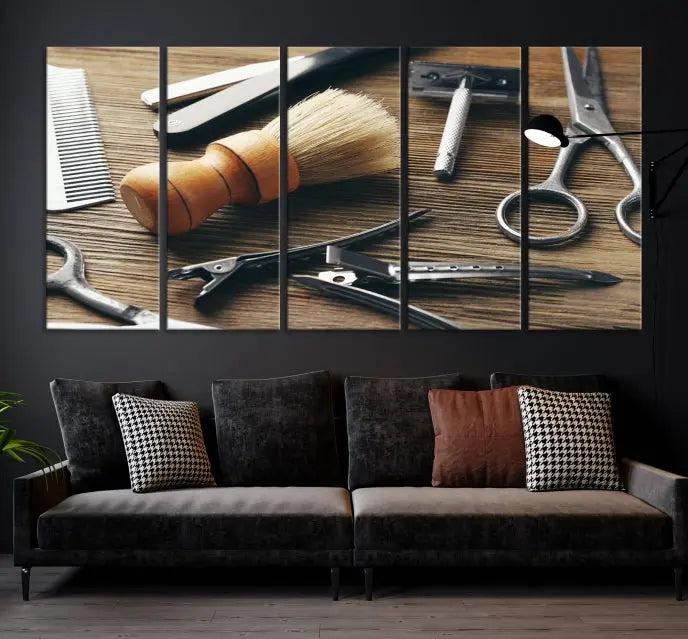 The Barber Tools Wall Art Canvas Print elegantly showcases the barbering profession with illustrations of tools like scissors, a brush, and a comb.