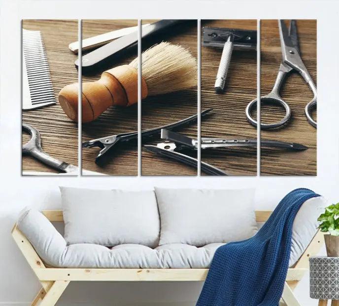 The Barber Tools Wall Art Canvas Print elegantly showcases the barbering profession with illustrations of tools like scissors, a brush, and a comb.