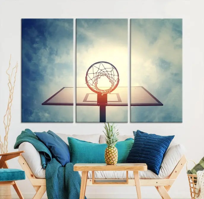 A triptych wall art titled "Basketball Hoop Wall Art Canvas Print | Sport Wall Art" features a basketball hoop set against a cloudy sky. It is printed on museum-quality canvas with gallery wrapping.