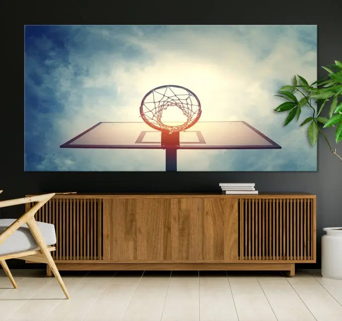 A triptych wall art titled "Basketball Hoop Wall Art Canvas Print | Sport Wall Art" features a basketball hoop set against a cloudy sky. It is printed on museum-quality canvas with gallery wrapping.