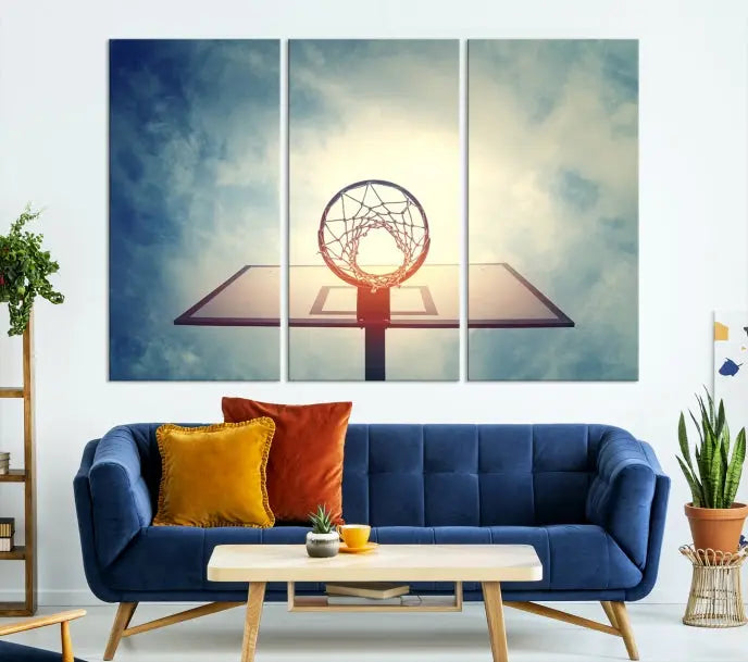 A triptych wall art titled "Basketball Hoop Wall Art Canvas Print | Sport Wall Art" features a basketball hoop set against a cloudy sky. It is printed on museum-quality canvas with gallery wrapping.