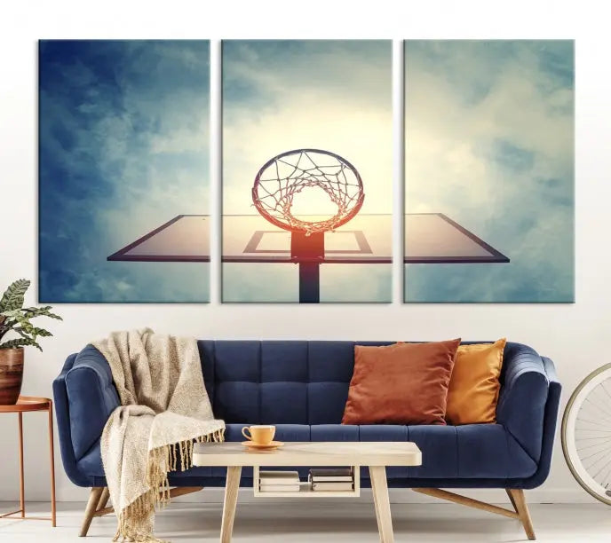 A triptych wall art titled "Basketball Hoop Wall Art Canvas Print | Sport Wall Art" features a basketball hoop set against a cloudy sky. It is printed on museum-quality canvas with gallery wrapping.