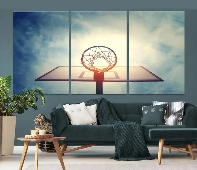 A triptych wall art titled "Basketball Hoop Wall Art Canvas Print | Sport Wall Art" features a basketball hoop set against a cloudy sky. It is printed on museum-quality canvas with gallery wrapping.