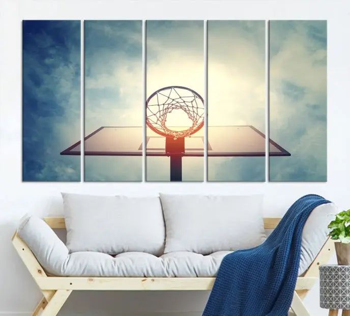 A triptych wall art titled "Basketball Hoop Wall Art Canvas Print | Sport Wall Art" features a basketball hoop set against a cloudy sky. It is printed on museum-quality canvas with gallery wrapping.