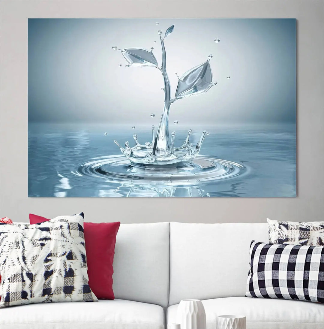 The living room features a three-panel wall art titled "Bathroom Wall Art Blue Leaf Canvas," showcasing water splash shapes that form plant-like designs on gallery-wrapped, museum-quality canvas.