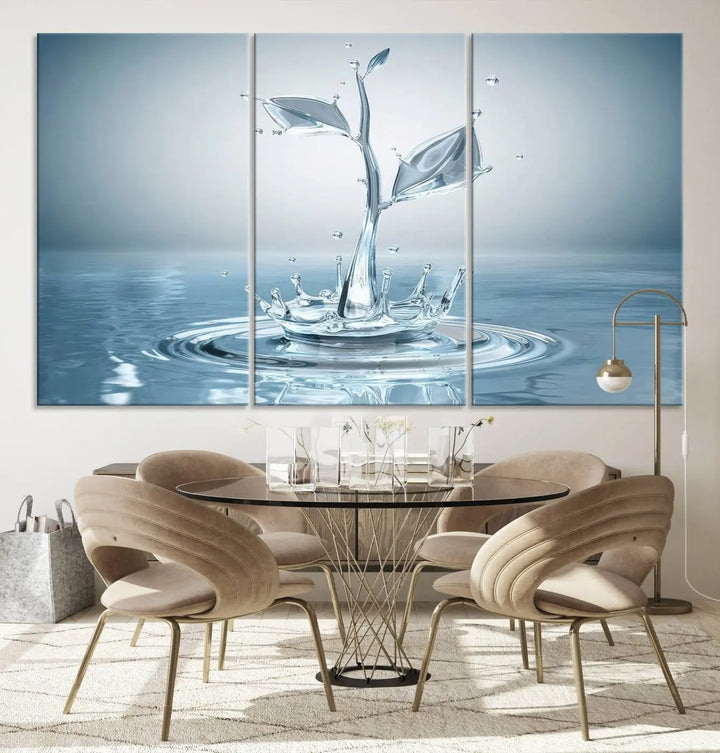 The living room features a three-panel wall art titled "Bathroom Wall Art Blue Leaf Canvas," showcasing water splash shapes that form plant-like designs on gallery-wrapped, museum-quality canvas.