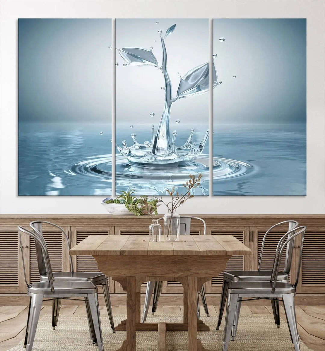 The living room features a three-panel wall art titled "Bathroom Wall Art Blue Leaf Canvas," showcasing water splash shapes that form plant-like designs on gallery-wrapped, museum-quality canvas.