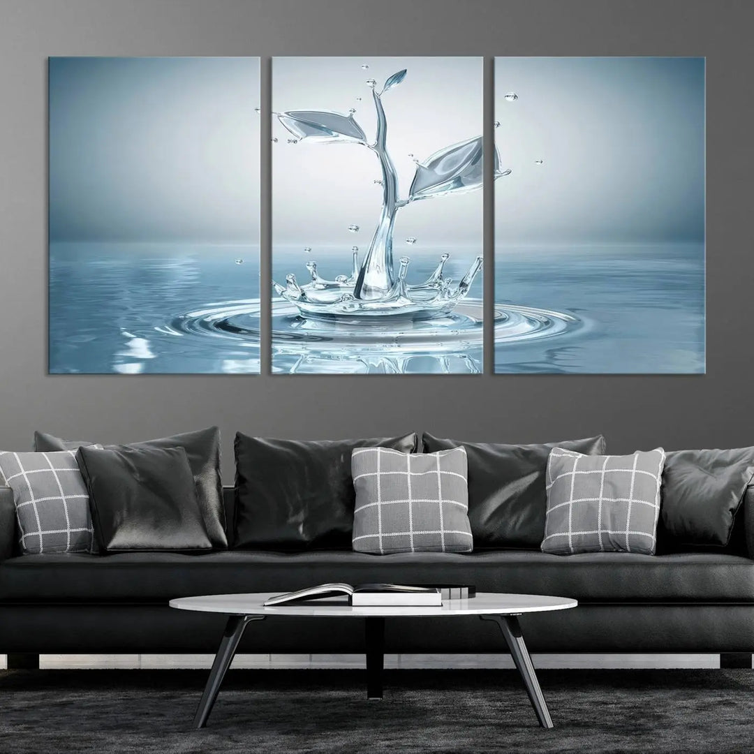 The living room features a three-panel wall art titled "Bathroom Wall Art Blue Leaf Canvas," showcasing water splash shapes that form plant-like designs on gallery-wrapped, museum-quality canvas.