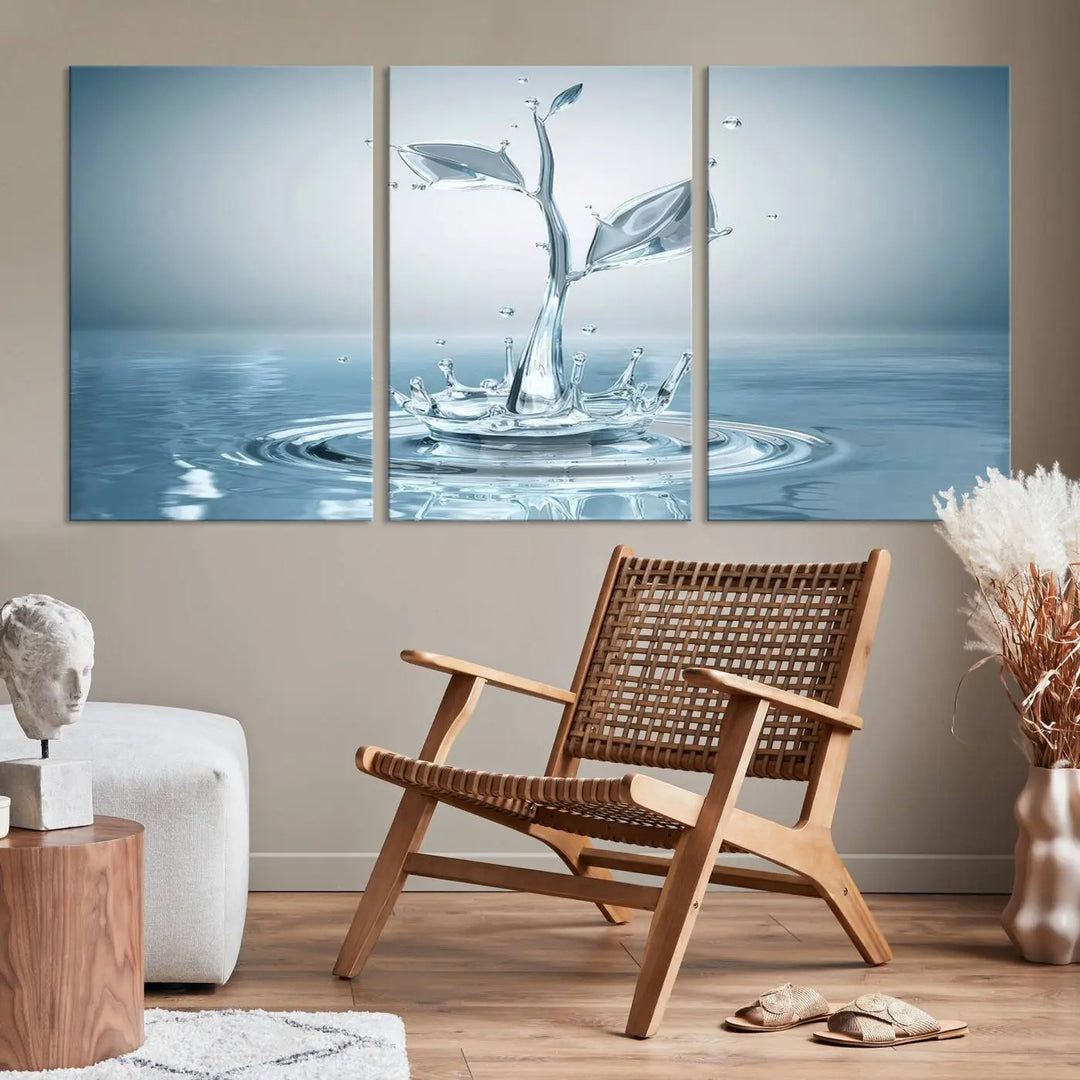 The living room features a three-panel wall art titled "Bathroom Wall Art Blue Leaf Canvas," showcasing water splash shapes that form plant-like designs on gallery-wrapped, museum-quality canvas.