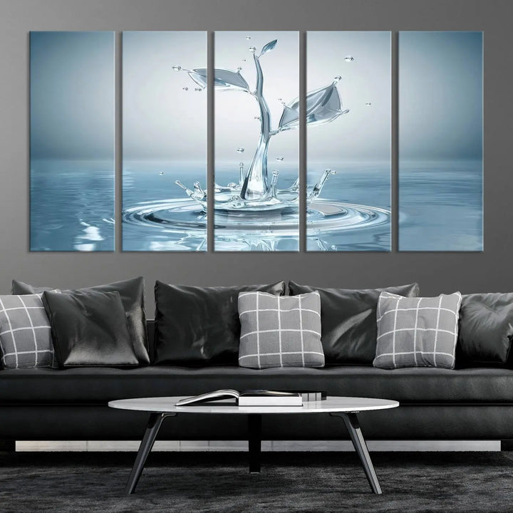 The living room features a three-panel wall art titled "Bathroom Wall Art Blue Leaf Canvas," showcasing water splash shapes that form plant-like designs on gallery-wrapped, museum-quality canvas.