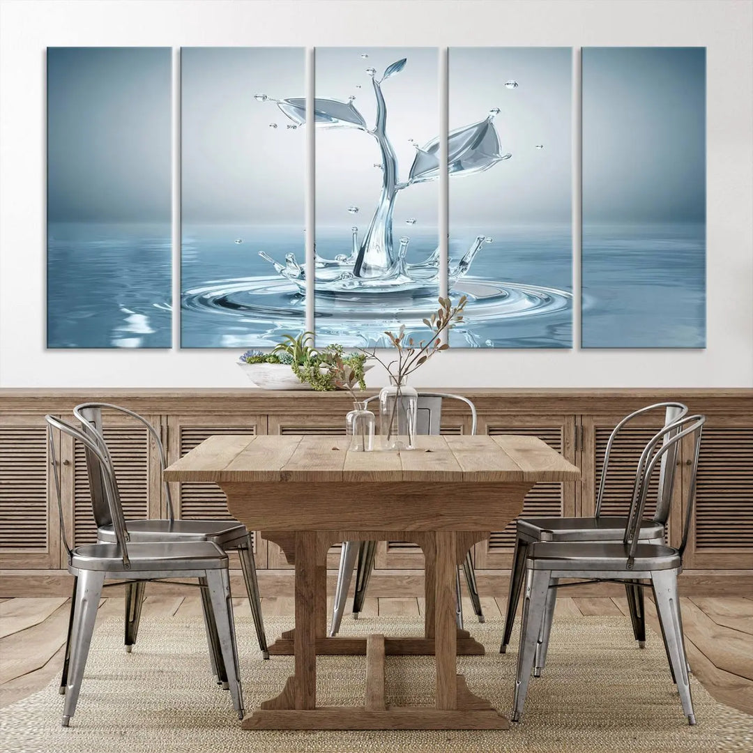 The living room features a three-panel wall art titled "Bathroom Wall Art Blue Leaf Canvas," showcasing water splash shapes that form plant-like designs on gallery-wrapped, museum-quality canvas.