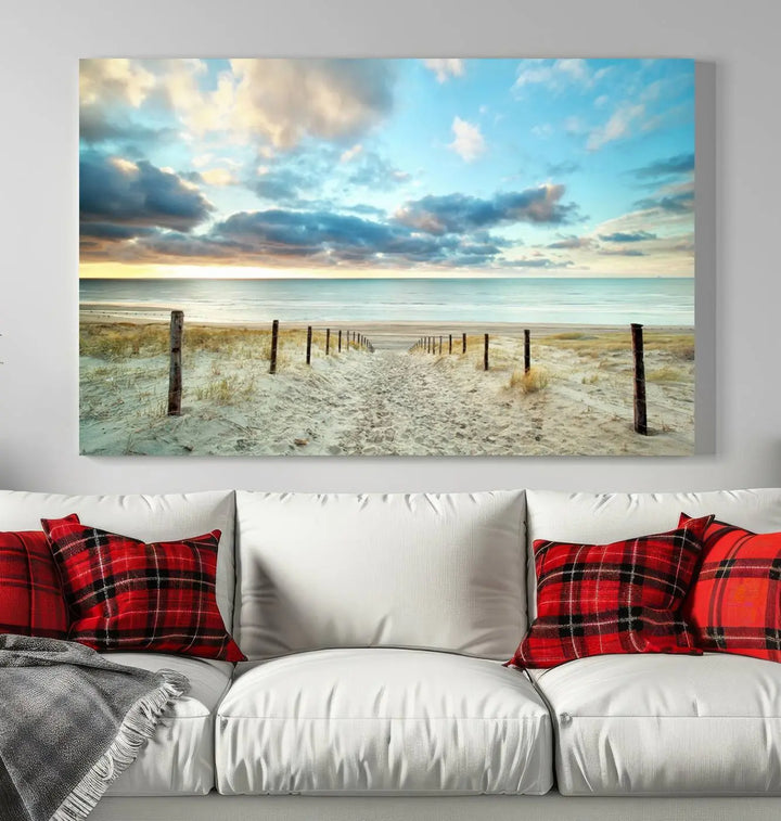 The Beach Ocean Sunset Sand Wall Art Canvas Print, renowned for its museum-quality and UV-protective coating, is elegantly displayed on a dark wall.