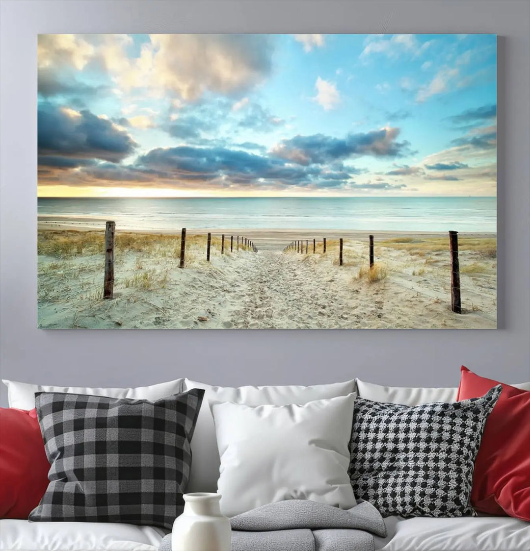 The Beach Ocean Sunset Sand Wall Art Canvas Print, renowned for its museum-quality and UV-protective coating, is elegantly displayed on a dark wall.