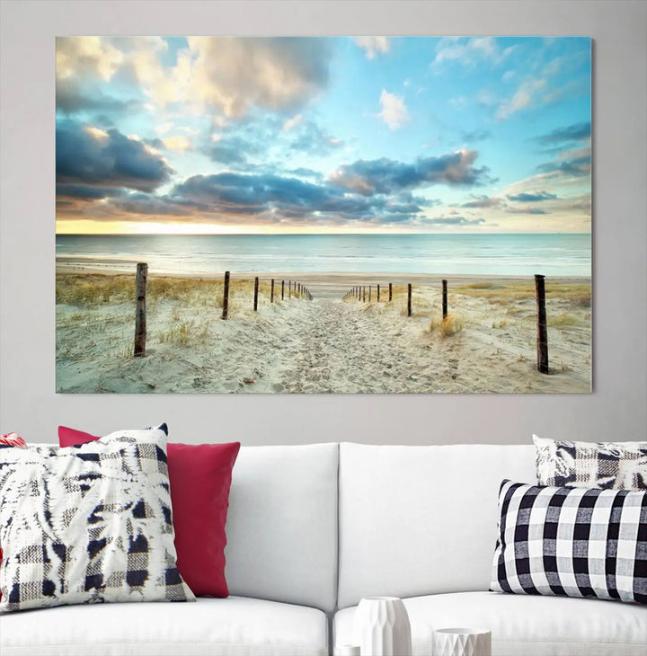 The Beach Ocean Sunset Sand Wall Art Canvas Print, renowned for its museum-quality and UV-protective coating, is elegantly displayed on a dark wall.