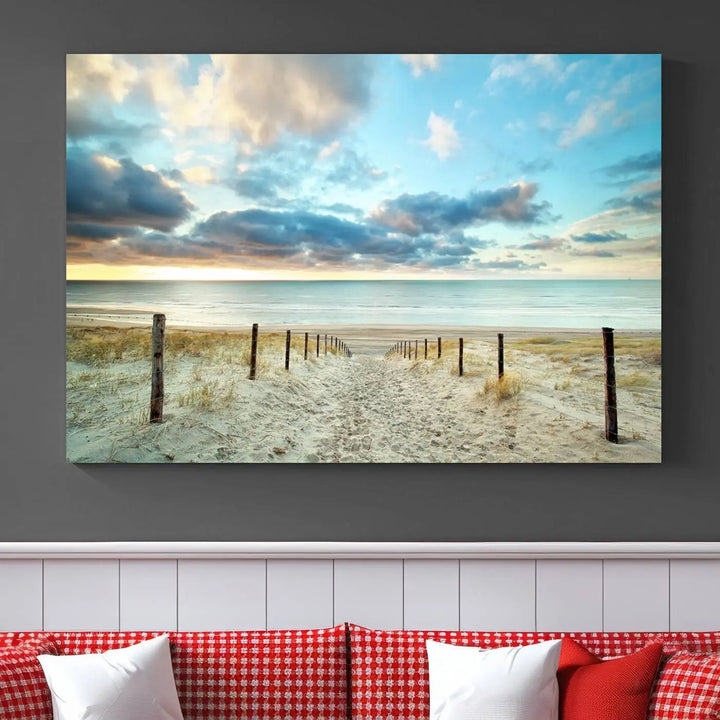 The Beach Ocean Sunset Sand Wall Art Canvas Print, renowned for its museum-quality and UV-protective coating, is elegantly displayed on a dark wall.