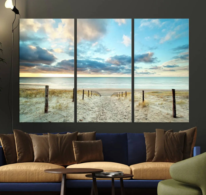 The Beach Ocean Sunset Sand Wall Art Canvas Print, renowned for its museum-quality and UV-protective coating, is elegantly displayed on a dark wall.