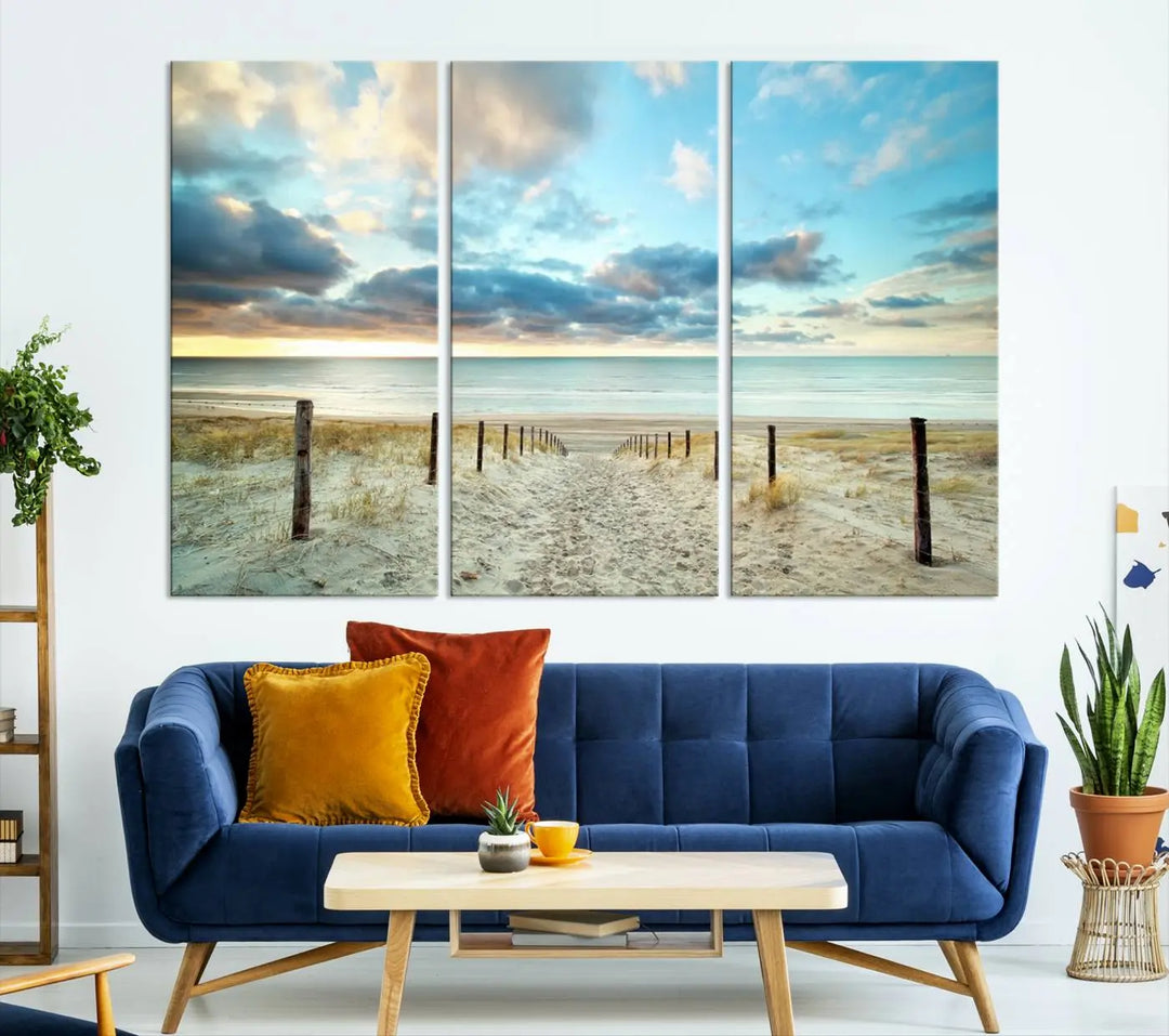 The Beach Ocean Sunset Sand Wall Art Canvas Print, renowned for its museum-quality and UV-protective coating, is elegantly displayed on a dark wall.