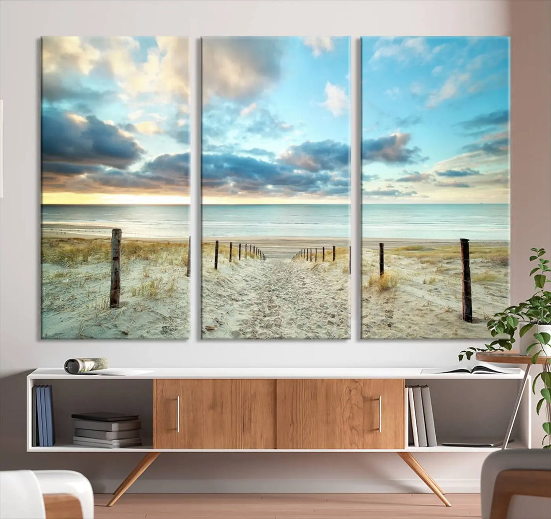 The Beach Ocean Sunset Sand Wall Art Canvas Print, renowned for its museum-quality and UV-protective coating, is elegantly displayed on a dark wall.