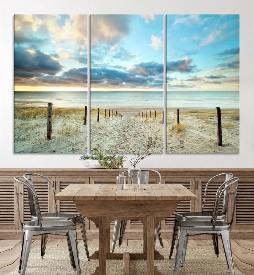 The Beach Ocean Sunset Sand Wall Art Canvas Print, renowned for its museum-quality and UV-protective coating, is elegantly displayed on a dark wall.