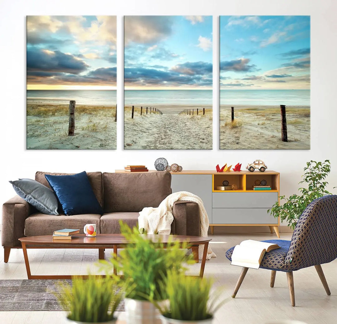 The Beach Ocean Sunset Sand Wall Art Canvas Print, renowned for its museum-quality and UV-protective coating, is elegantly displayed on a dark wall.