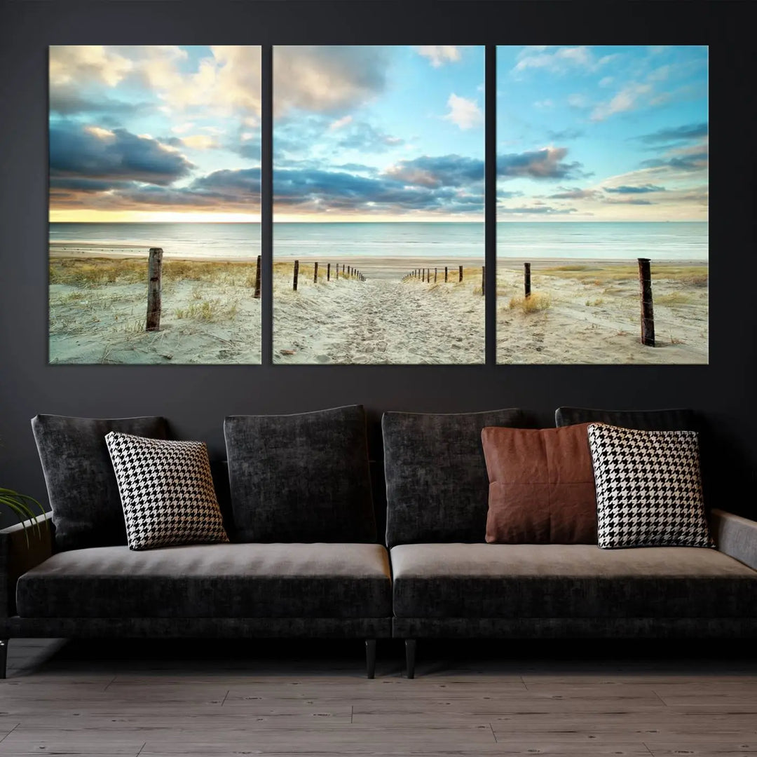 The Beach Ocean Sunset Sand Wall Art Canvas Print, renowned for its museum-quality and UV-protective coating, is elegantly displayed on a dark wall.