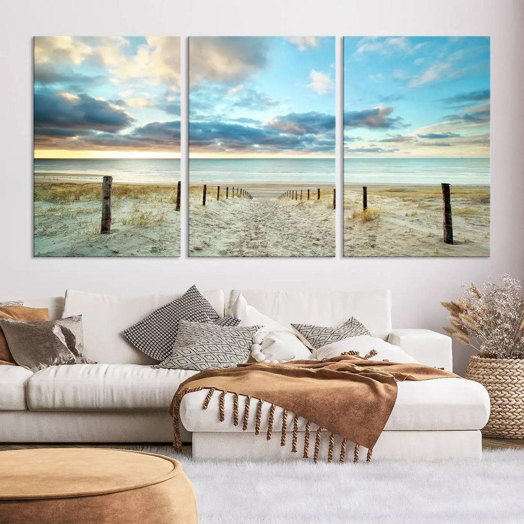 The Beach Ocean Sunset Sand Wall Art Canvas Print, renowned for its museum-quality and UV-protective coating, is elegantly displayed on a dark wall.