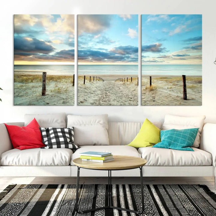 The Beach Ocean Sunset Sand Wall Art Canvas Print, renowned for its museum-quality and UV-protective coating, is elegantly displayed on a dark wall.