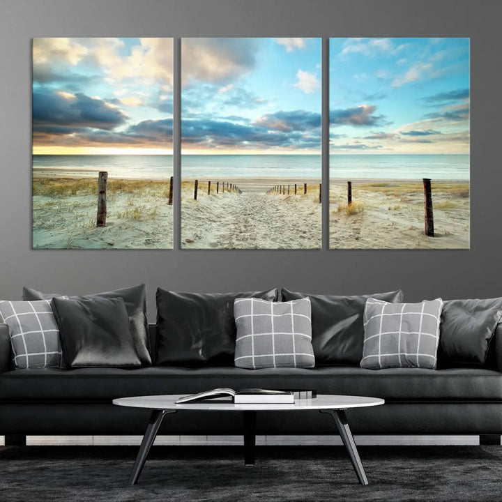 The Beach Ocean Sunset Sand Wall Art Canvas Print, renowned for its museum-quality and UV-protective coating, is elegantly displayed on a dark wall.