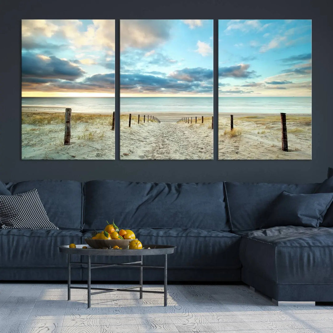 The Beach Ocean Sunset Sand Wall Art Canvas Print, renowned for its museum-quality and UV-protective coating, is elegantly displayed on a dark wall.