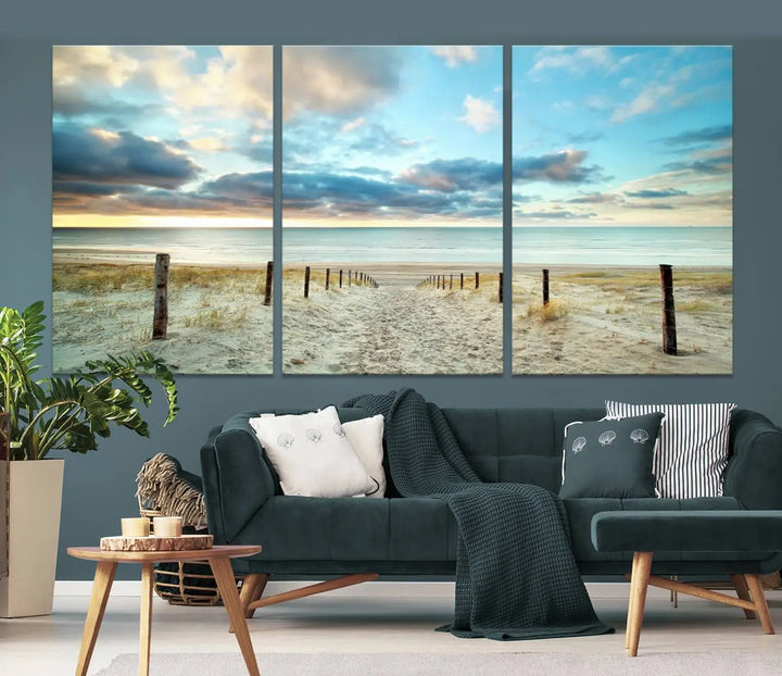 The Beach Ocean Sunset Sand Wall Art Canvas Print, renowned for its museum-quality and UV-protective coating, is elegantly displayed on a dark wall.