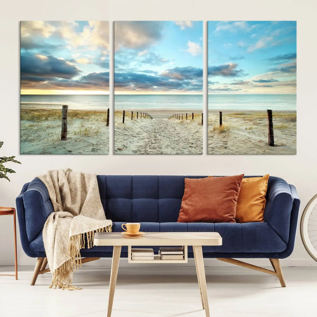 The Beach Ocean Sunset Sand Wall Art Canvas Print, renowned for its museum-quality and UV-protective coating, is elegantly displayed on a dark wall.