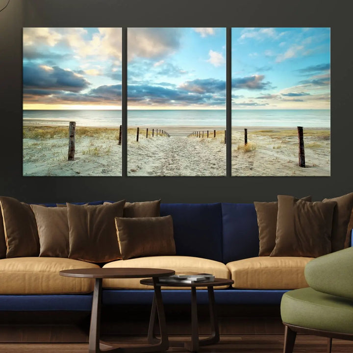 The Beach Ocean Sunset Sand Wall Art Canvas Print, renowned for its museum-quality and UV-protective coating, is elegantly displayed on a dark wall.